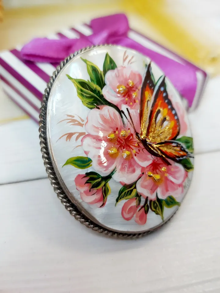 Brooches for women: A delicate butterfly on wild rose blossoms mother of pearl pin, hand painted pink floral brooch made from shell