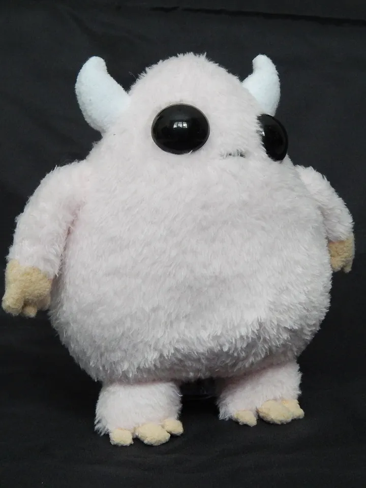 Cute pink fluffy monster toy
