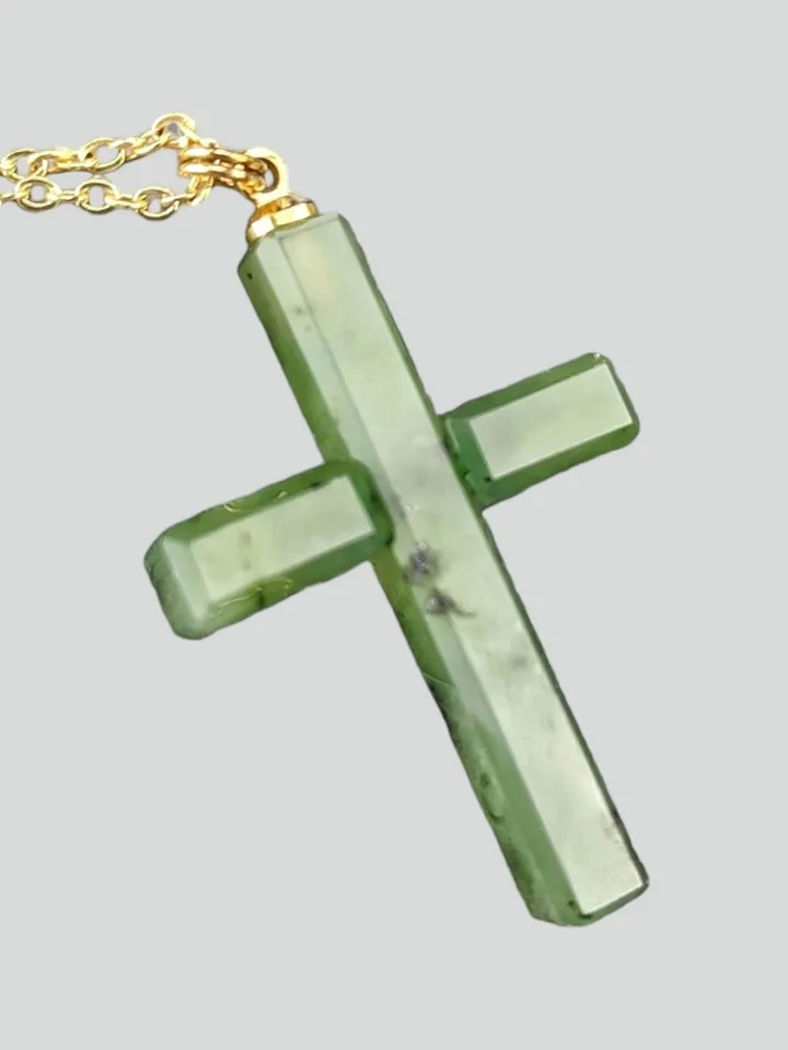 Christian cross pendant green jade on a gold plated chain.