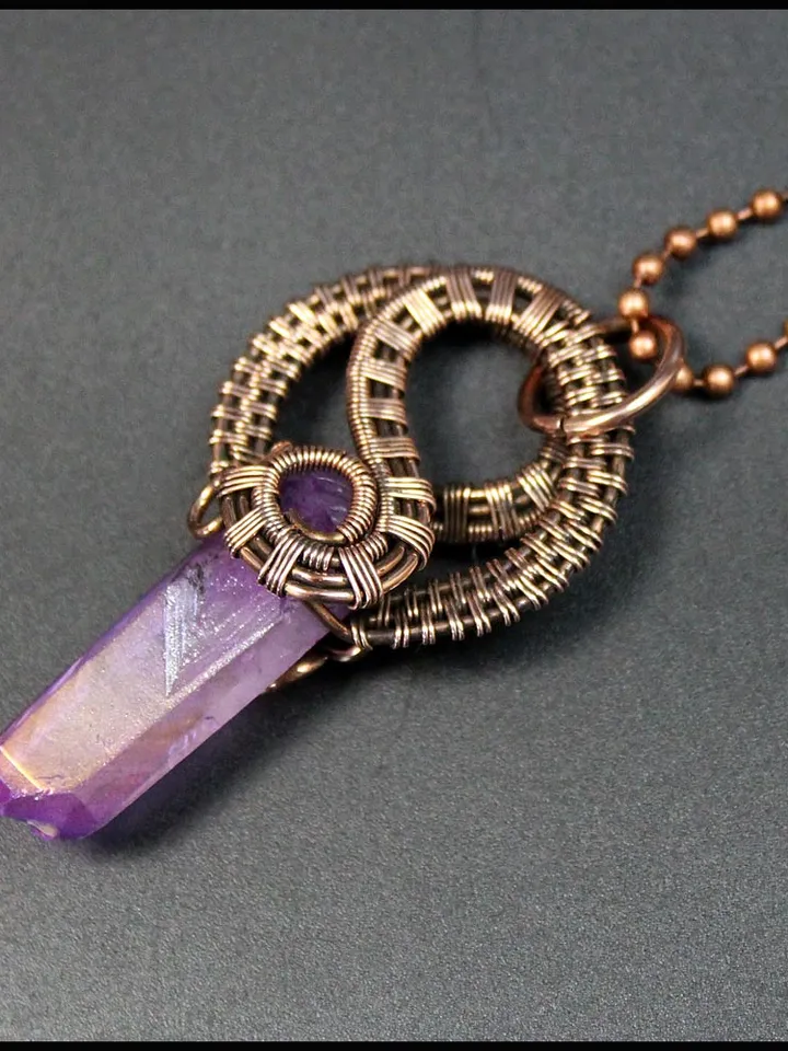 Handmade copper wire pendant with quartz crystal.