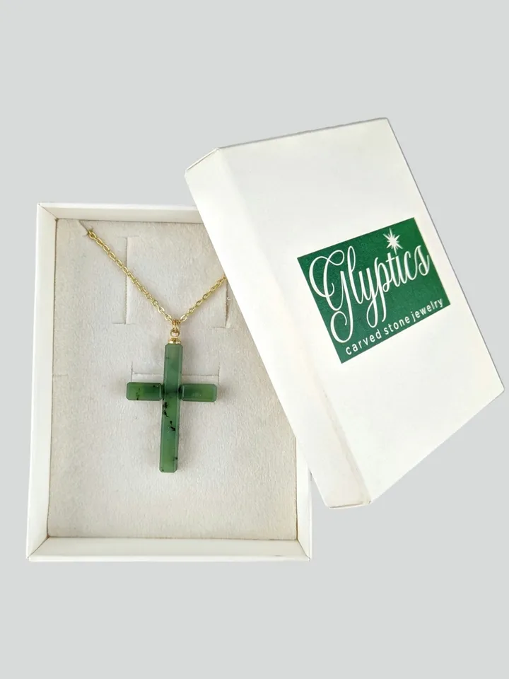 Christian cross pendant green jade on a gold plated chain.