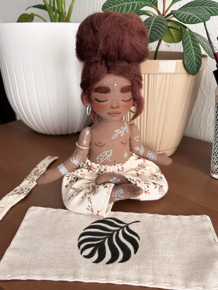Textile doll yoga girl with dark hair and tattoo