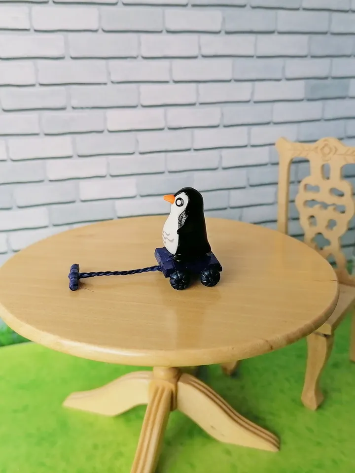 Penguin on a cart. Doll miniature.1:12.
