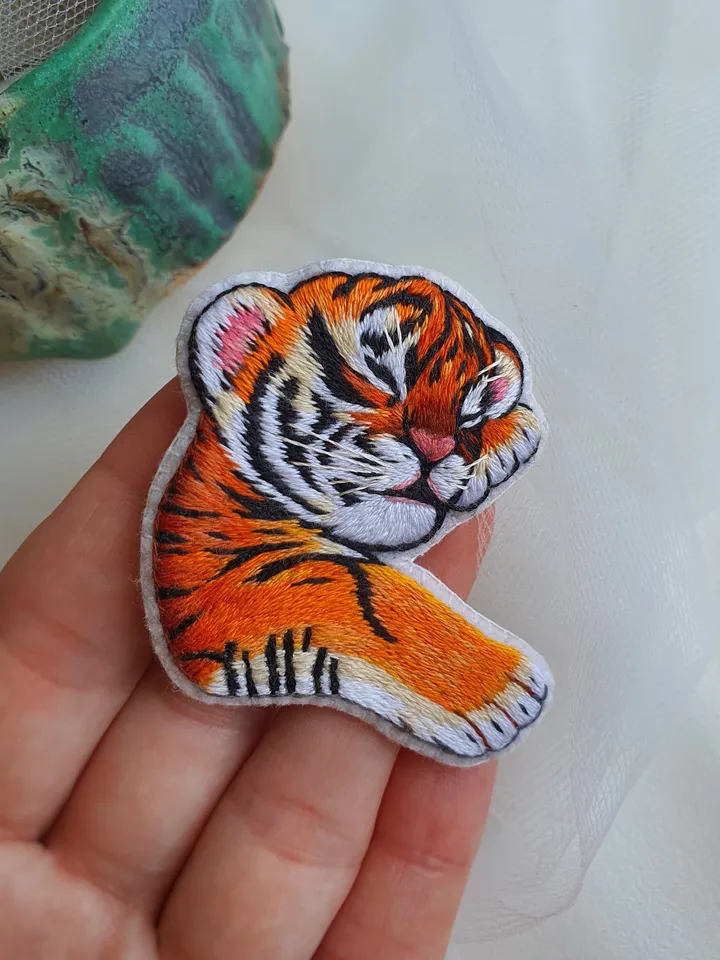 Sleeping Tiger Cub Brooch. Hand-embroidered with satin stitch