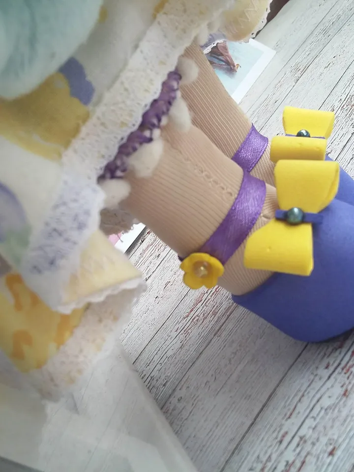 Doll Princess in the crown with an elephant in her hands, with yellow hair, beautiful, interior, birthday present, holiday