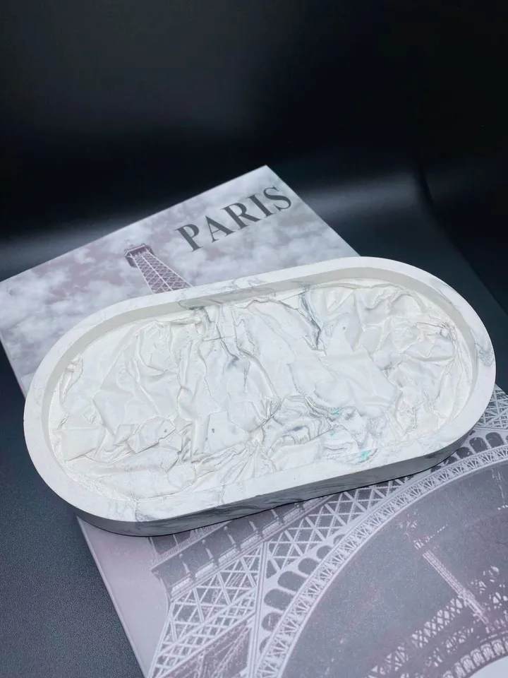 Decorative oval tray with a design solution made of plaster