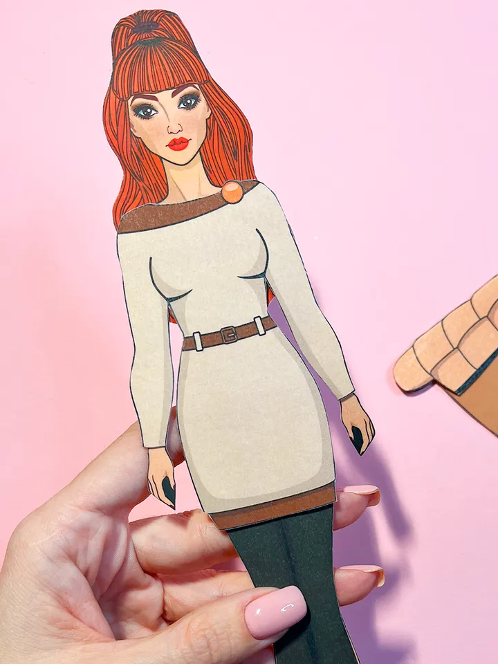 Paper doll in autumn clothes