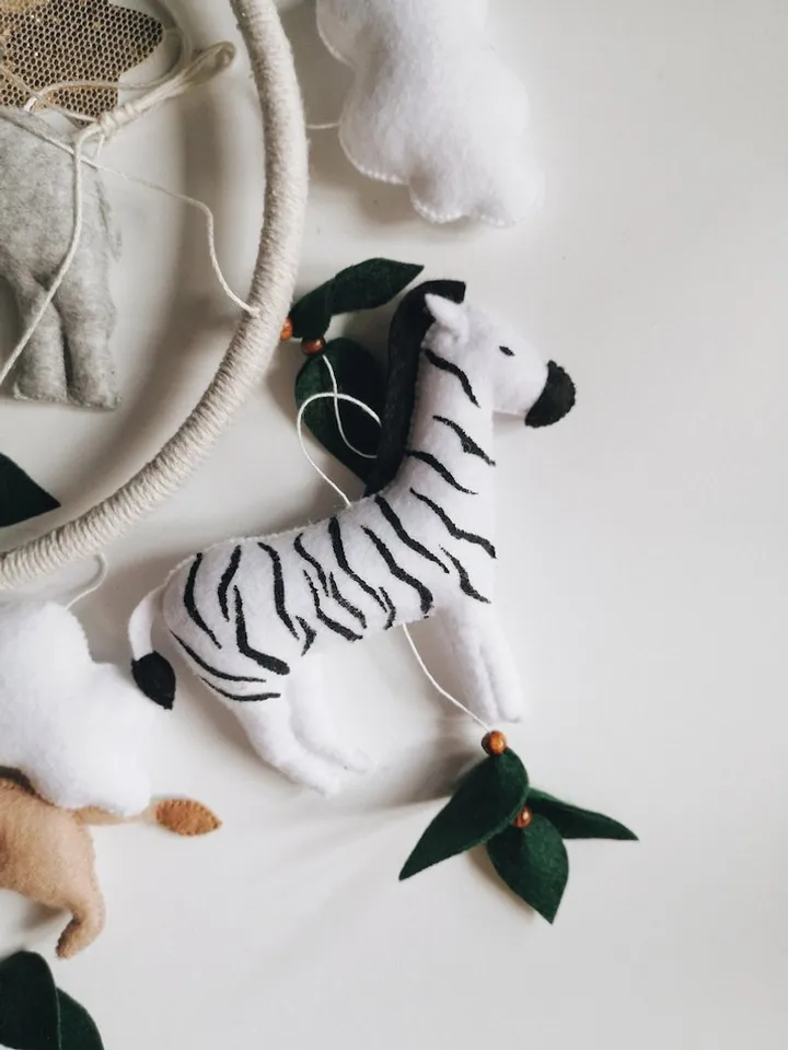 Safari mobile baby nursery decor crib