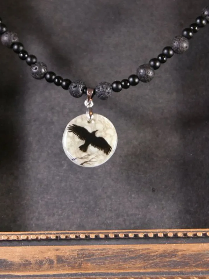 Raven or crow necklace with love rune on the other side. Nacre pearl pendant