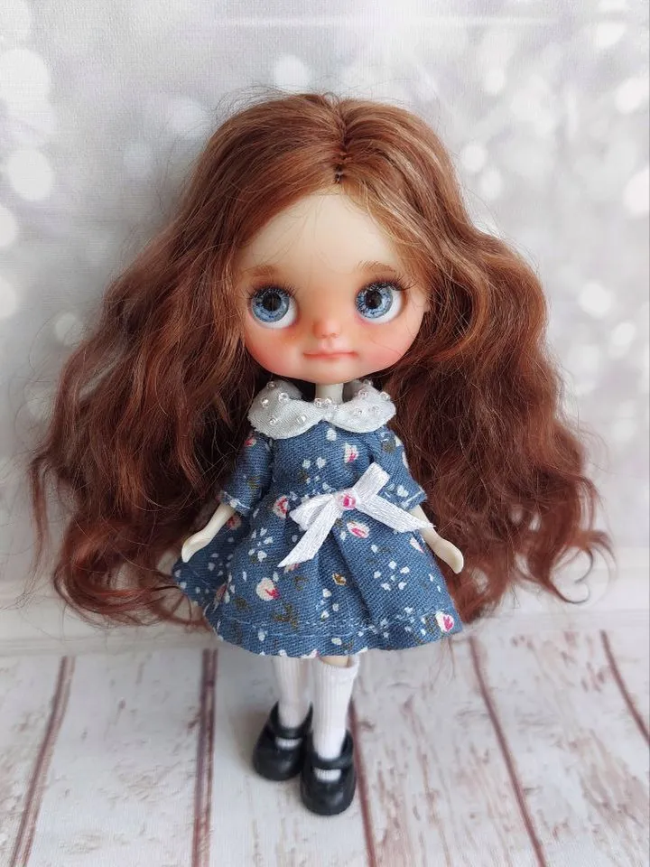 Charming little girl with brown hair and blue eyes. Author's miniature doll for your collection.