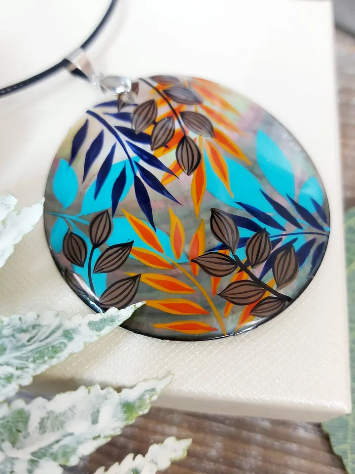 Artistic Expression in Nacre: Abstract Botanical Hand-Painted Mother-of-Pearl Pendant - Captivating Blue and Orange Leaf Motif