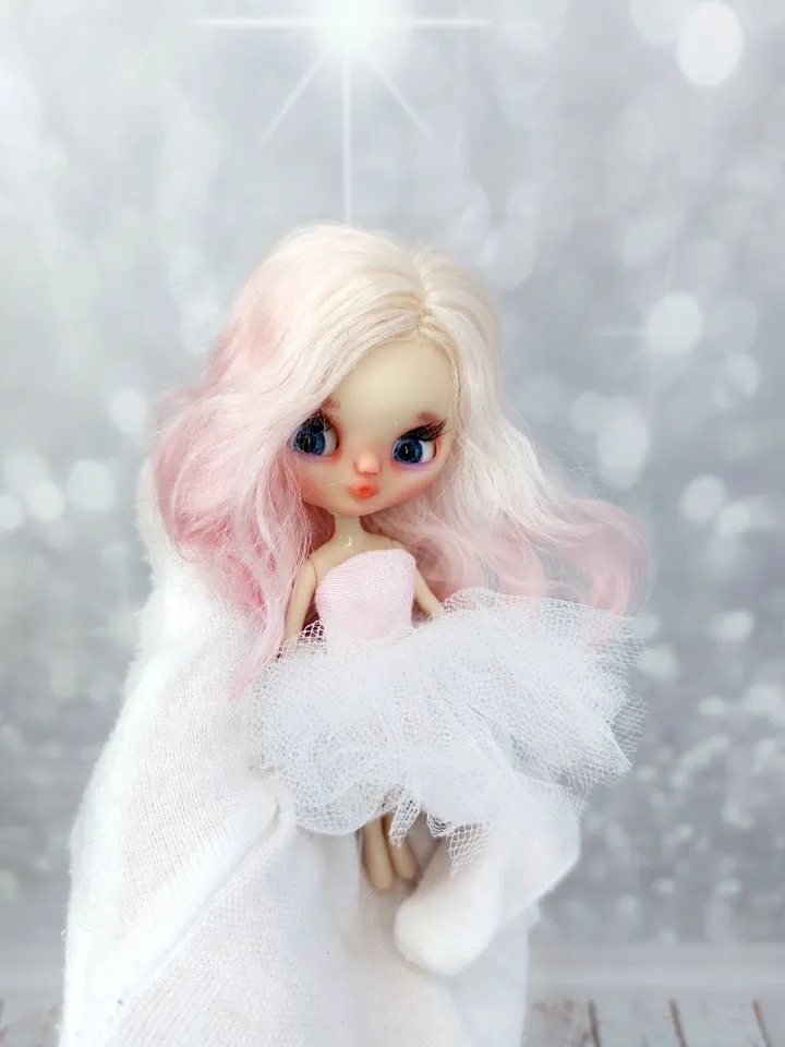 Petite Blythe doll with pink hair. Small doll with eye mechanism. Doll with a kiss.