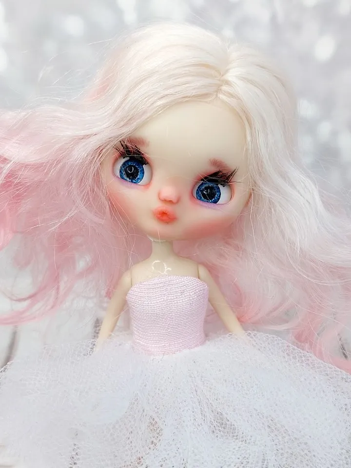 Petite Blythe doll with pink hair. Small doll with eye mechanism. Doll with a kiss.
