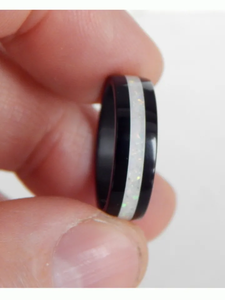 Stylish black ring. Carbon ring with synthetic opal. 8