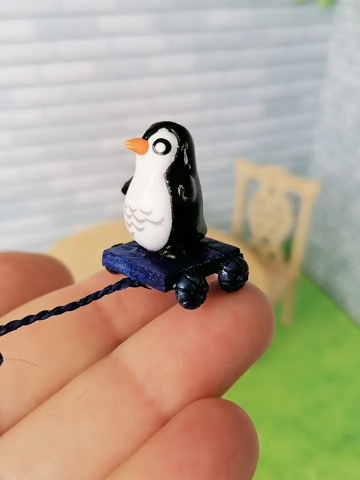 Penguin on a cart. Doll miniature.1:12.