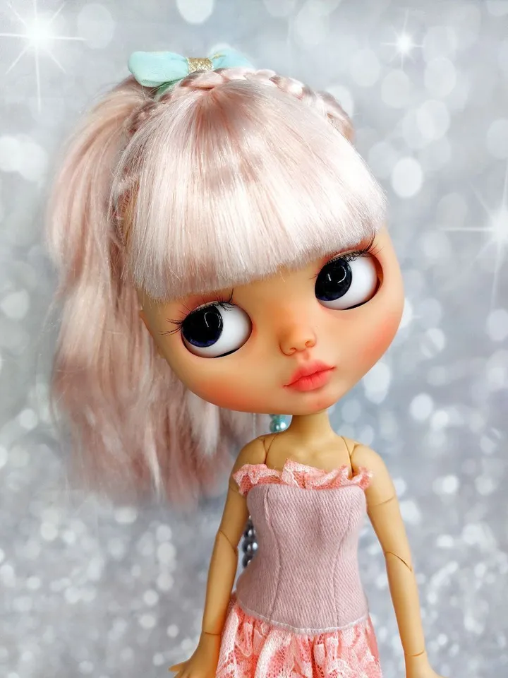 Lovely Blythe doll with delicate pink hair.