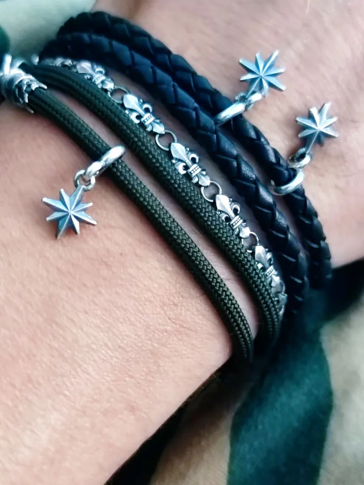 Designer multilayer bracelet with elements of chain, genuine leather and paracord