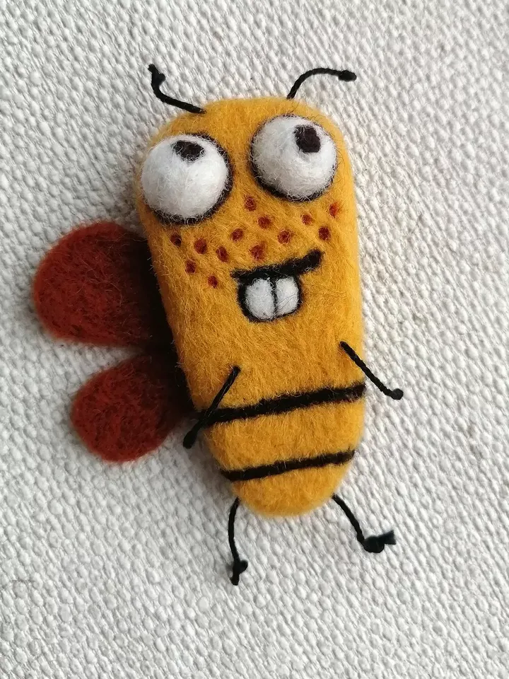 Funny mustard Bee brooch with canopies for a red-haired girl with freckles