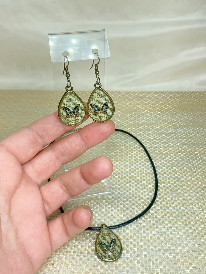 Handmade jewelry set. Shiny butterflies in a bronze frame. designer jewelry.