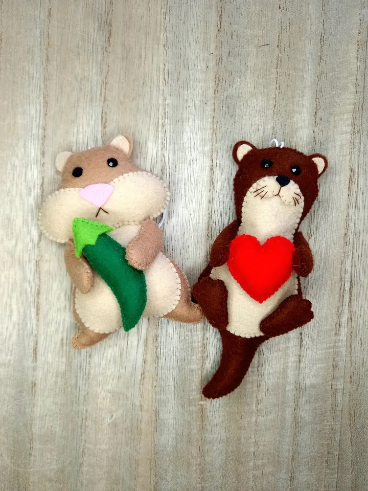 Felt otter. Otter with a red heart. Otter toy. New Year's decor otter. New Year's ornament otter