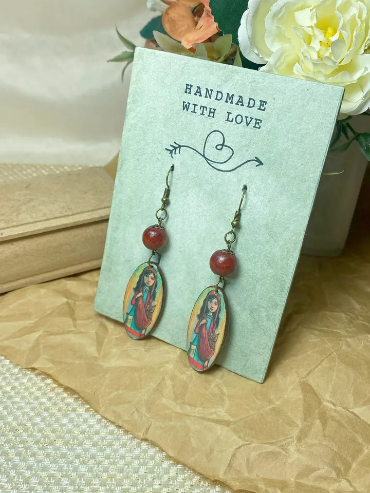 Handmade earrings. Author's design. Jewelry.Earrings with a picture of a girl. Wooden earrings.