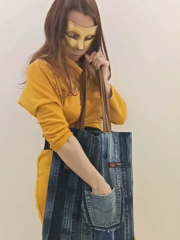 Large denim shopper, shopping bag, city bag, made from recycled jeans, with comfortable handles 60 cm long. Comfortable to wear on the shoulder. Bag with lining made of black synthetic fabric, 2 pockets and strong handles made of 2-color straps. The front