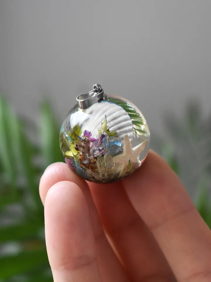 Shell with a pearl pendant. Sea pendant with shell, pearl and real flowers. Pinctada pendant.