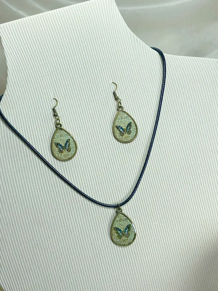 Handmade jewelry set. Shiny butterflies in a bronze frame. designer jewelry.