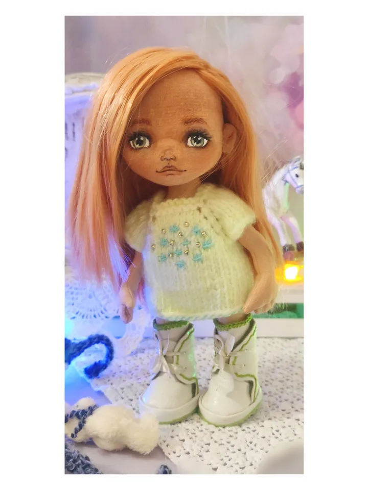 Cute little girl doll with a bunny