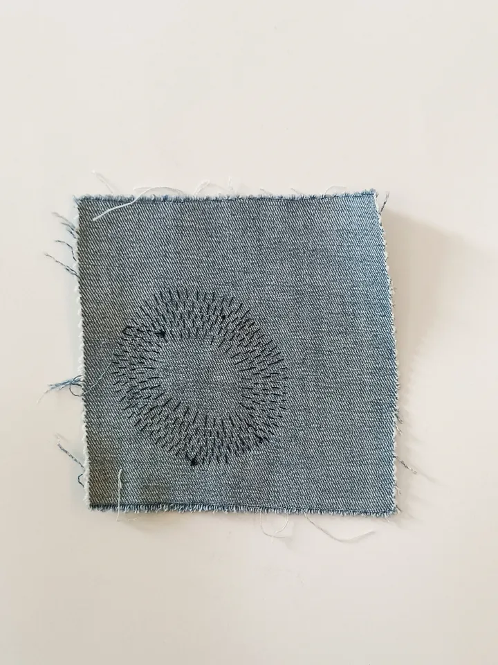 Upcycled denim boro patch. Sashiko stitching.