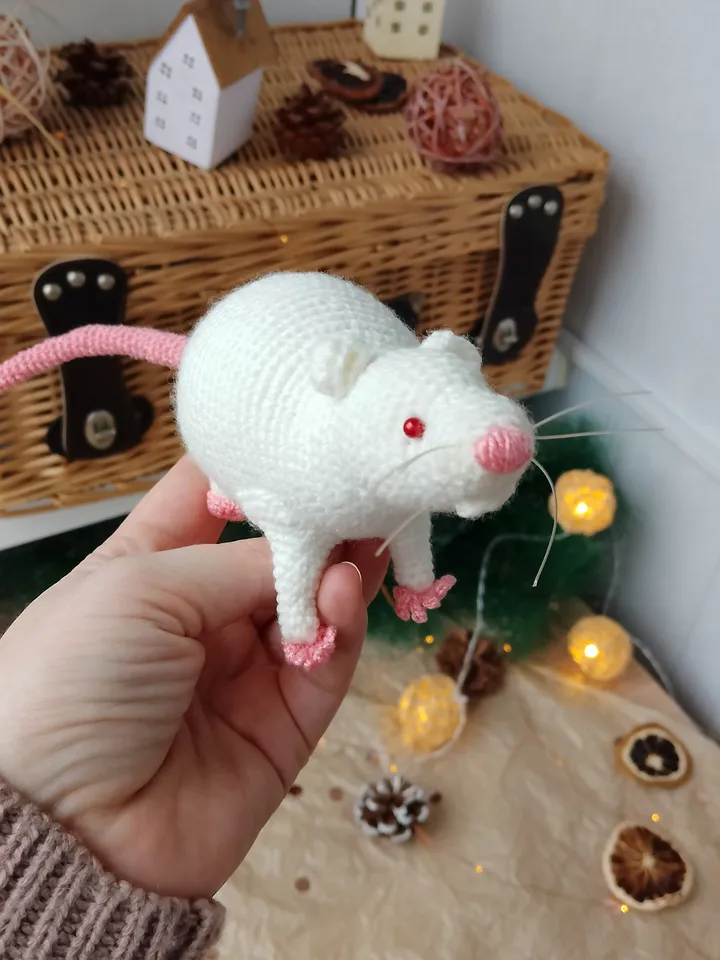 White mouse toy. Soft toy life-size white rat with red eyes.