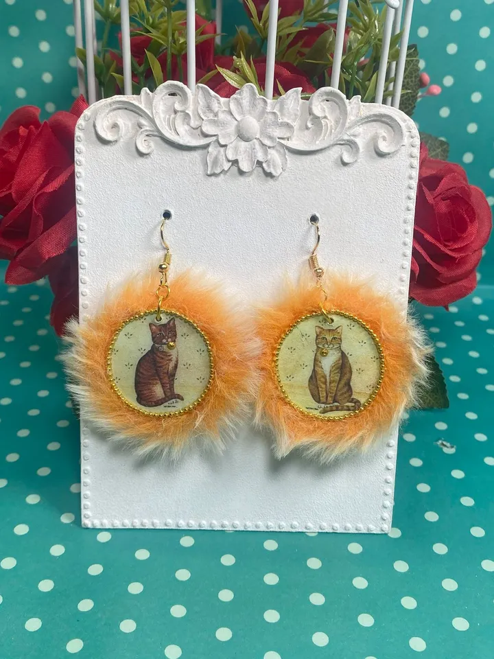 Cute handmade earrings. Image of cats, fur trim.