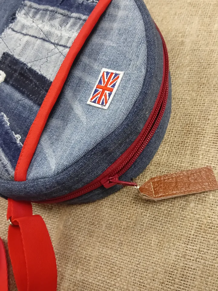Cute handmade denim round crossbody bag with Red belt, brown polka dot cotton inside, pockets inside and outside, leather zipper stripe, weight only 160 grams, very light. A handbag for walks, excursions, and travel.