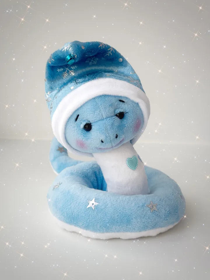 Christmas plush snakes. Handmade cute snakes in holiday hat for home decor. Christmas snakes for gift.
