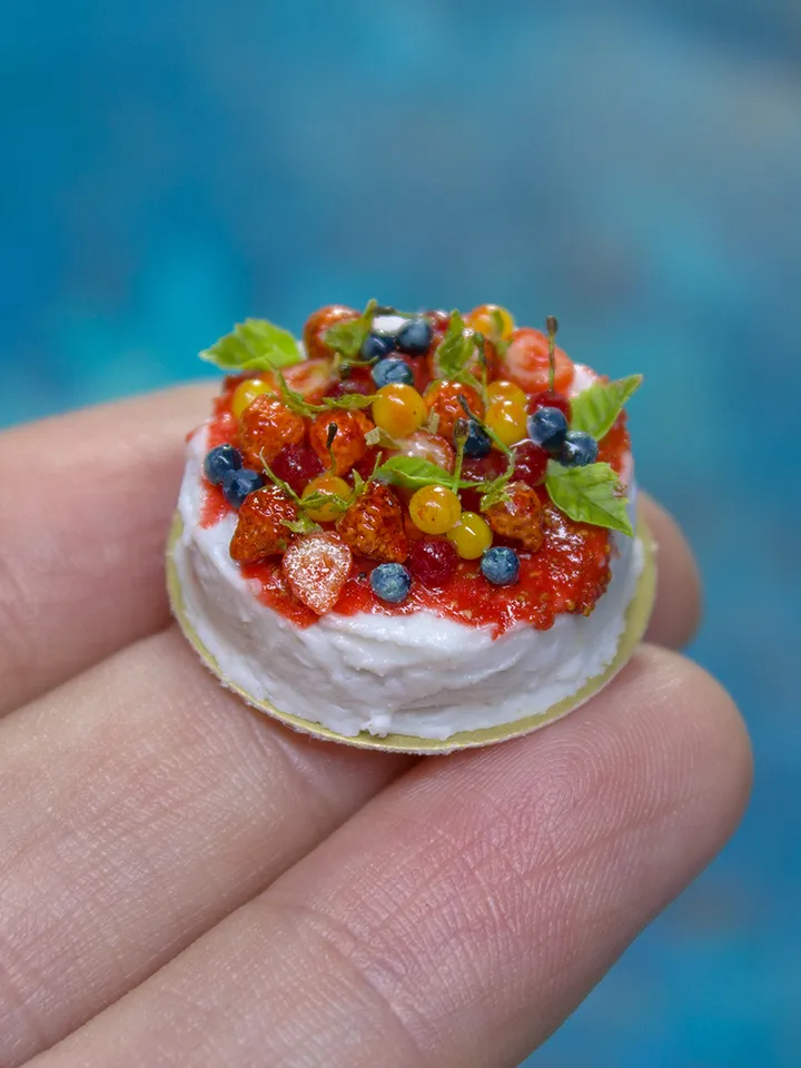 MINIATURE cake with berries on a gold cardboard stand 3