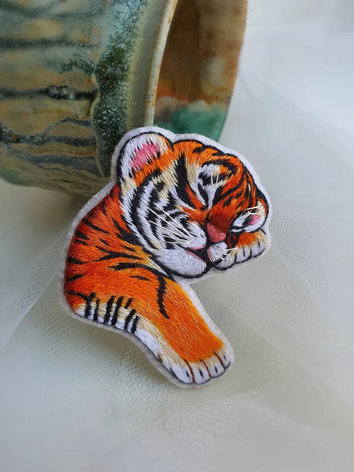 Sleeping Tiger Cub Brooch. Hand-embroidered with satin stitch