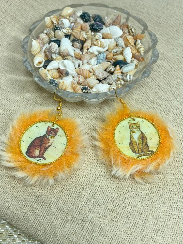 Cute handmade earrings. Image of cats, fur trim.