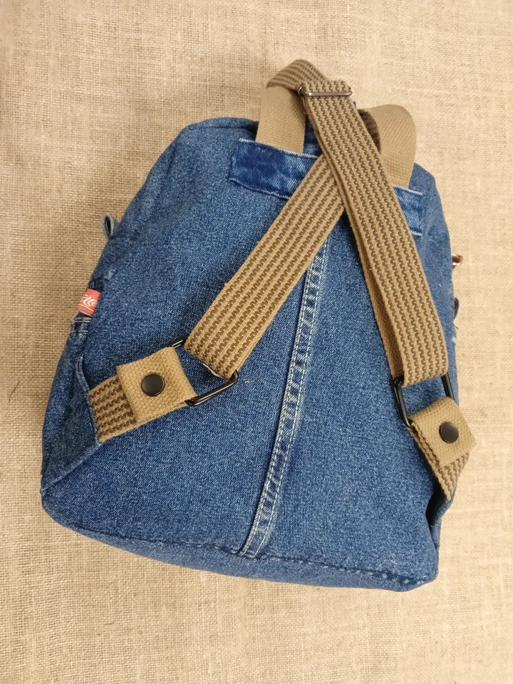 Stylish Denim backpack with 100 percent cotton lining, handmade, jeans recycling, 6 pockets.
