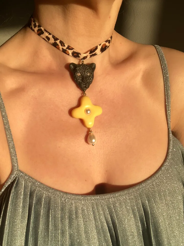 A choker around the neck on a ribbon