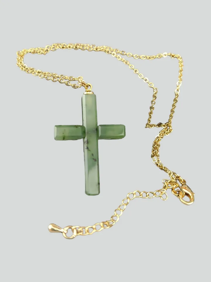 Christian cross pendant green jade on a gold plated chain.