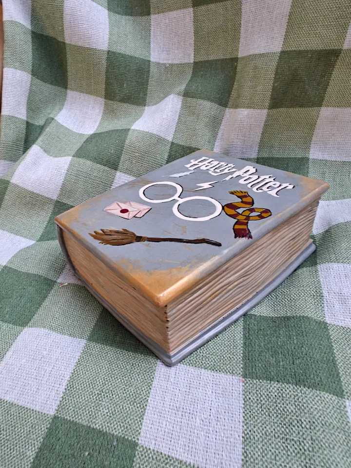 Candle in a plaster form of a book