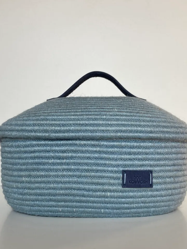 Oval jute basket with leather handle 9.5'' x 6.5''