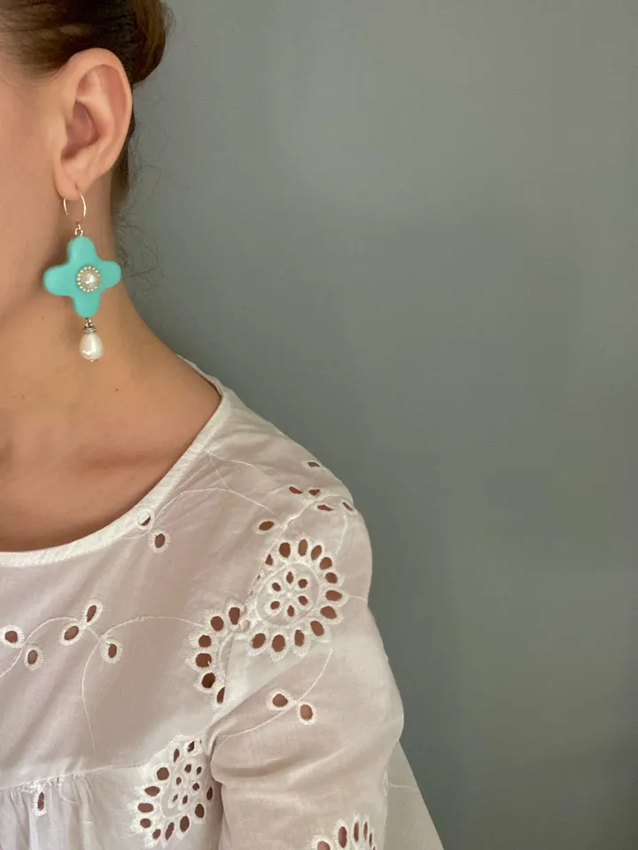 Earrings are handmade from polymer clay