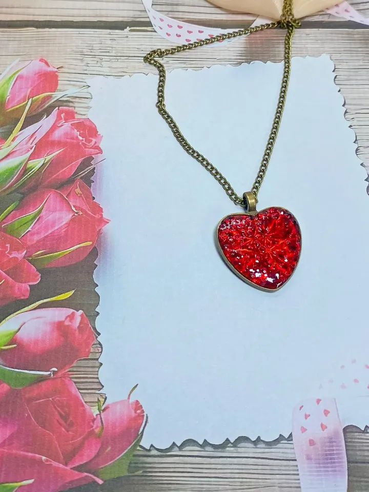 Pendant on a cord. Red heart. Handmade jewelry.3D effect.
