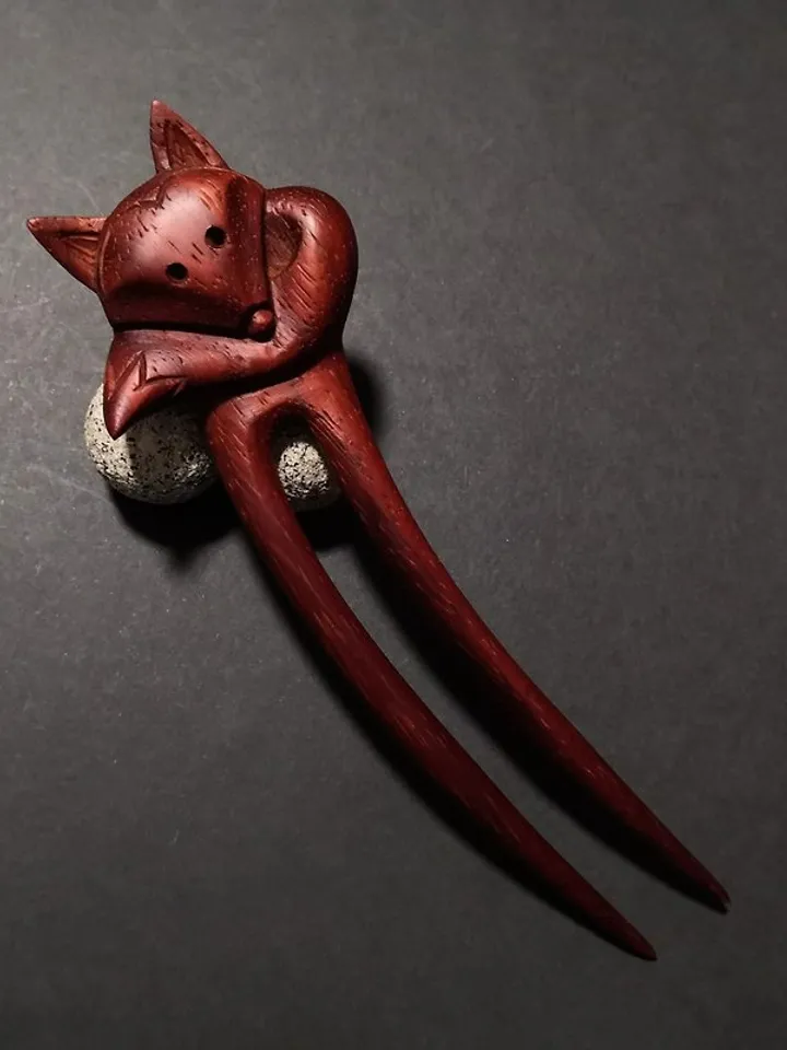 Carved wooden hairpin with a fox.