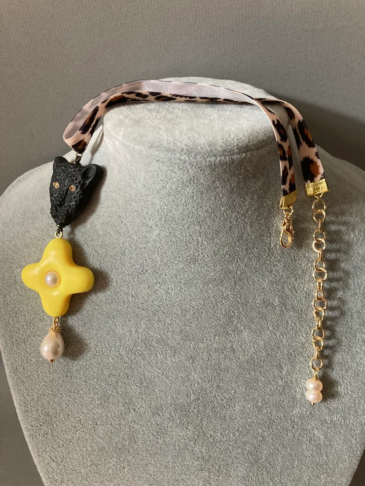 A choker around the neck on a ribbon