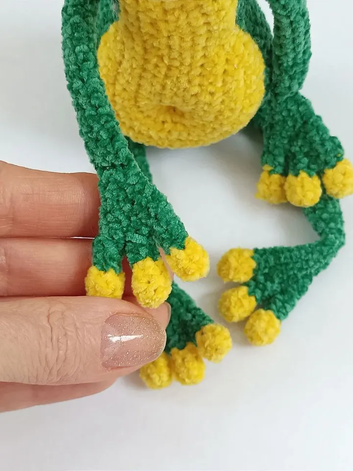 Funny soft toy frog in a hat