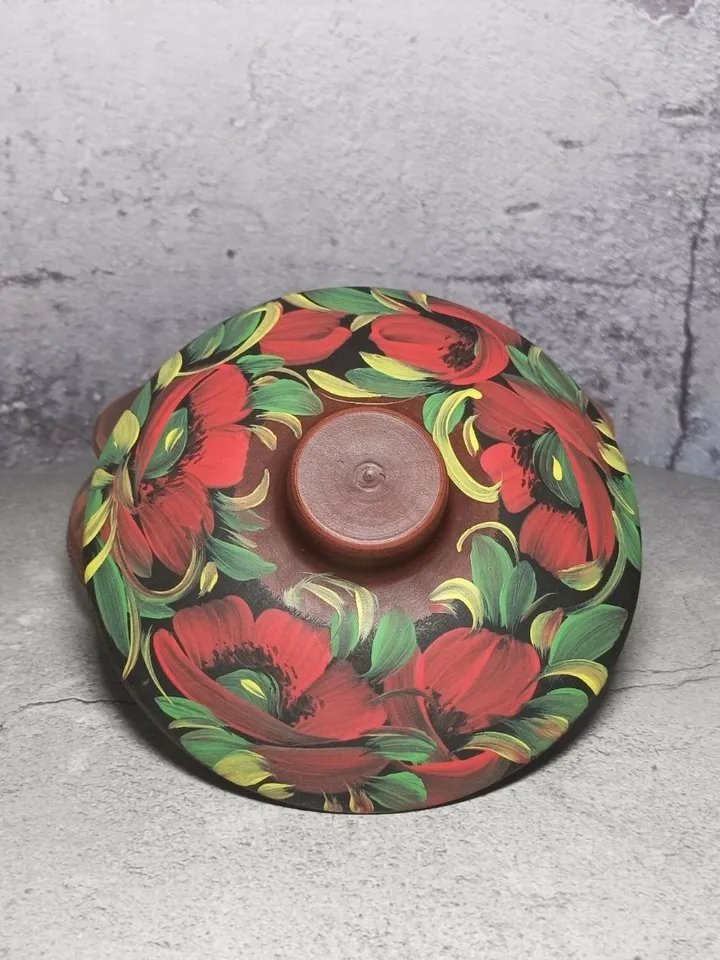 Ceramic casserole with a lid. Handmade from red clay. Carved pattern