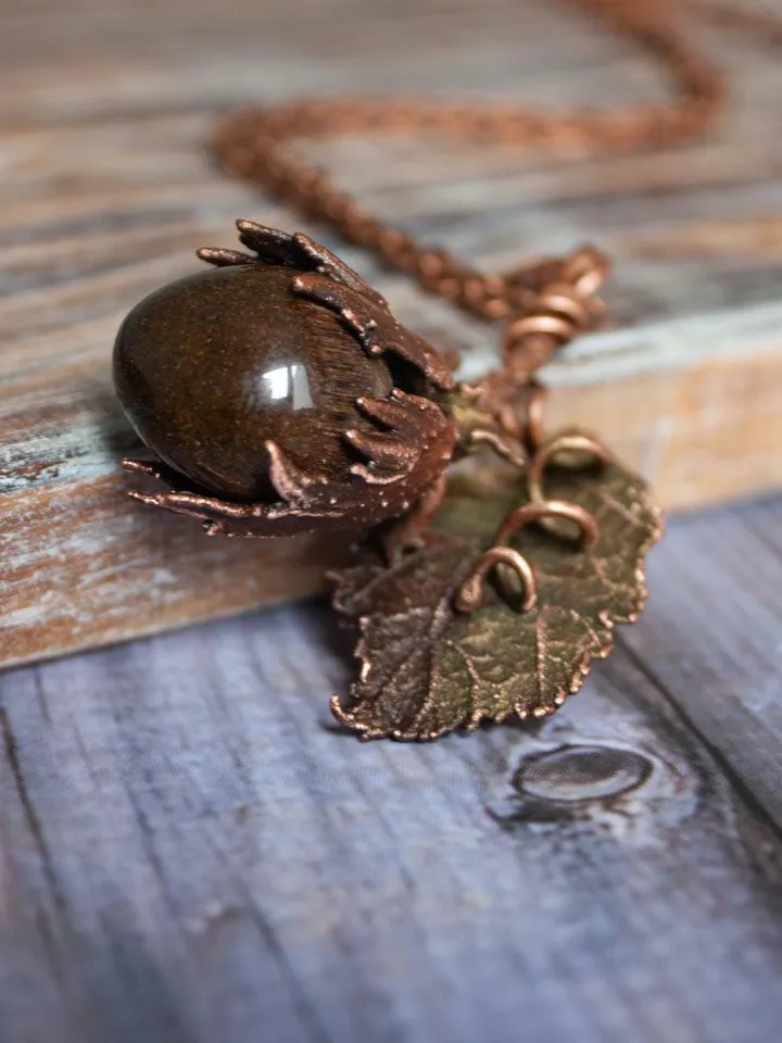 Unique handmade electroformed pendant made of natural leaves and twigs with natural tiger eye stone