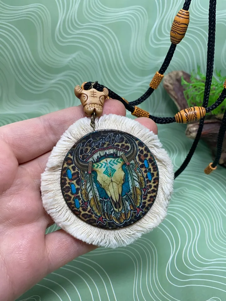 A set of interesting handmade jewelry.Handmade jewelry. Author's design. Set of earrings + pendant on a cord.